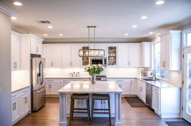 Do Hardwood Floors Go Under Kitchen Cabinets?